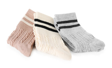 Many folded soft socks isolated on white