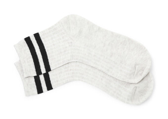 Pair of soft socks isolated on white, top view