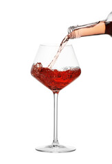 Pouring wine into glass on white background