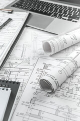 Architect?s deskdetailed blueprints, sketches,drafting tools.professional workspace showcasing the creative process of architectural design, planning, and innovation. Ideal. industry-themed visuals
