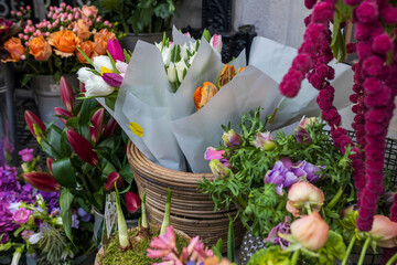Amaranthus in a vase, hyacinths, anemones, multicolored tulip bouquets in kraft paper, lilies, and...