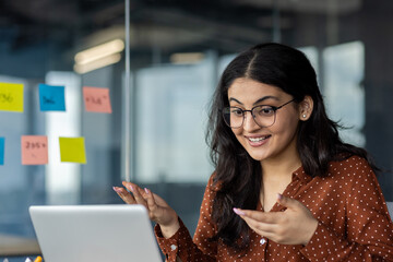 Businesswoman communicating during an online meeting, utilizing technology for effective...
