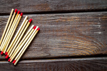 Matches for danger concept on wooden background top view mockup