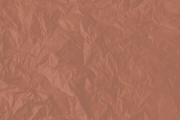 Crumpled paper Mocha Mousse color of the year 2025. Texture crumpled paper for your design. Copy space. Mocha Mousse color paper.