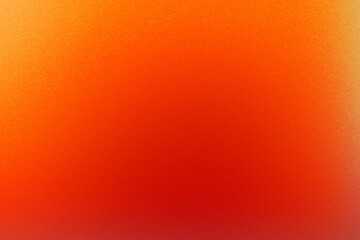 Abstract background in warm shades of red and orange with grain texture. Intense red in a warm and minimalistic gradient.