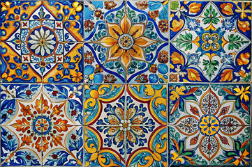 Vibrant ceramic tiles feature intricate floral patterns in blue, yellow, and orange, showcasing traditional craftsmanship and artistic design.