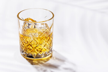 A refined glass of whiskey on the rocks
