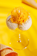 A refreshing ice cream set against a vibrant yellow background
