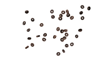 Chocolate rings cereal spill out into a bowl. Breakfast.