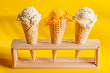 A refreshing ice cream cones set against a vibrant yellow background