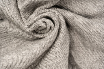 Grey wool sweater texture as a background.