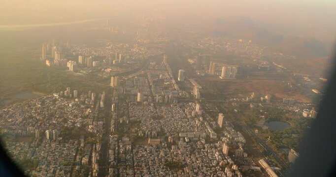 Dakc lake, Koperkhairne, Kopar Khairane, Navi Mumbai, Maharashtra, India. Mumbai Metropolitan Region. Aerial View From Airplane Window On View of the Mumbai suburb district. Evening morning sunset