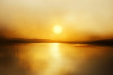 Obraz premium Golden sunset reflecting on calm water.