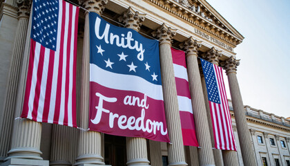 colorful banner depicting the U.S. national flag and the words "Unity and Freedom" adorns the columns of the historic building.