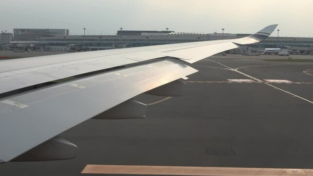 The airplane is accelerating on the runway, taking off smoothly