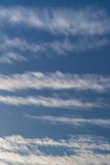 Serene Blue Sky with Wispy Clouds in a Tranquil Atmosphere of Nature