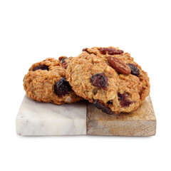 Delicious oatmeal cookies with dried cranberries and nuts isolated on white