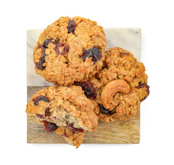 Delicious oatmeal cookies with dried cranberries and nuts isolated on white, top view