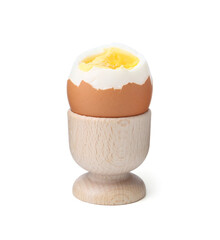 Soft boiled egg in eggcup isolated on white