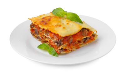 Piece of delicious cooked lasagna with basil isolated on white