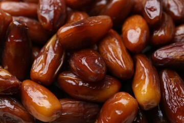 Tasty sweet dried dates as background, closeup