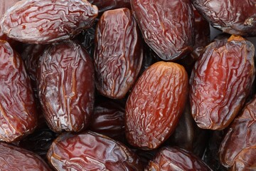 Many tasty dried dates as background, closeup