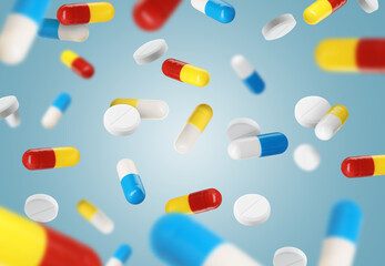 Antibiotic pills in air on color background