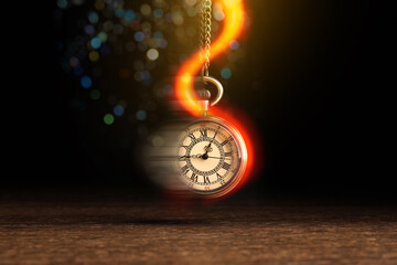 Hypnosis session. Vintage pocket watch swinging on black background, motion blur effect. Magic lights