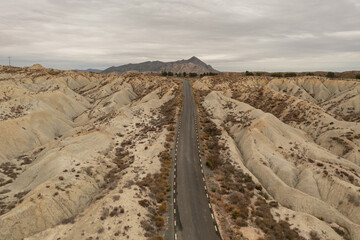 Aerial view of the road crossing the Abanilla desert or Mahoya desert in Murcia, Spain