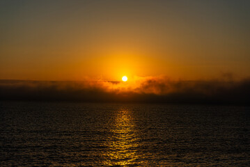 Naklejka premium Fog over the Atlantic Ocean at dawn