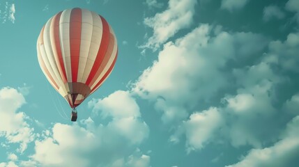 Fototapeta premium Hot Air Balloon Soaring Through a Cloudy Sky