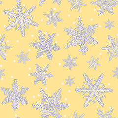Seamless winter seasonal pattern. Snowflakes, snowfall on yellow background. Hand drawn retro illustration	