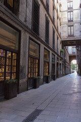 a narrow street between houses in the old quarter of the city