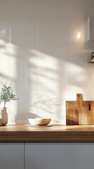 Sunlight casts soft shadows over a modern kitchen countertop with wooden accessories
