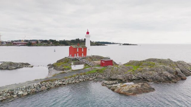 Victoria, British Columbia, Canada. November 02, 2024: Aerial view of the Fisgard Lighthouse at the Fisgard Lighthouse National Historic Site, highlighting its iconic red structure by the sea