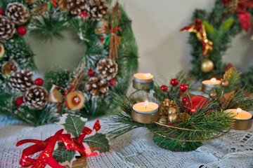 candles lighting in christmas wreath on table with christams light and decorations, Mahe Seychelles