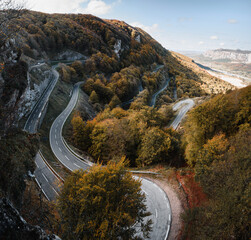 urves of a mountain pass road surrounded by forest in Urbasa, Navarra.