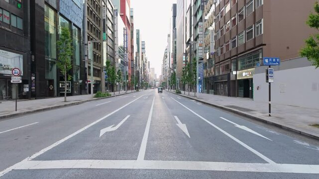 A stunningly empty urban street at dawn showcasing the beauty of a modern cityscape