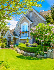 Two story stucco luxury house with nice summer  landscape in Vancouver, Canada, North America. Day...