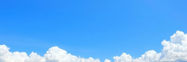 Border of blue sky with fluffy white clouds along the top and bottom edges, fluffy