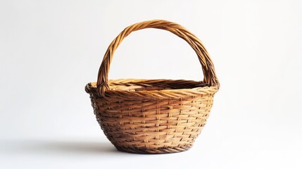 Rustic woven elm basket with handle elegantly positioned against a clean white background for artistic and decorative use.
