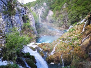 Waterfall in Plitvice lake, Cascading Through Lush Green Forest and Rocky Cliffs