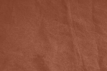 Mocha Mousse colour monochrome texture knitted fabric. Brown knitted Jersey as textile background. Monochrome color background. Wool knitting texture. Trendy color 2025.