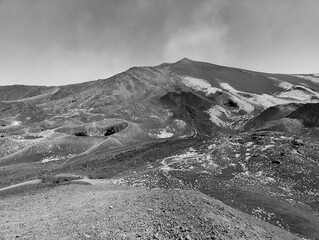 A black and white photo of a mountain covered in snow