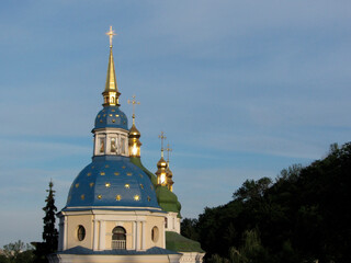 Image of a distinctive church with a large blue dome and smaller central dome topped by a cross Two...