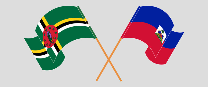 Crossed and waving flags of Dominica and Republic of Haiti. Vector illustration