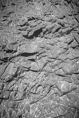 Texture of stone, granite gray wall