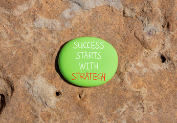 Success starts with strategy symbol. Concept words Success starts with strategy on beautiful green...