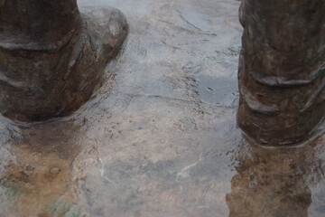 The feet of the statue in the park.