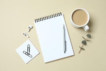 Business concept. Top view photo of workplace with planner, pen, coffee cup and eucalyptus on color background with blank space